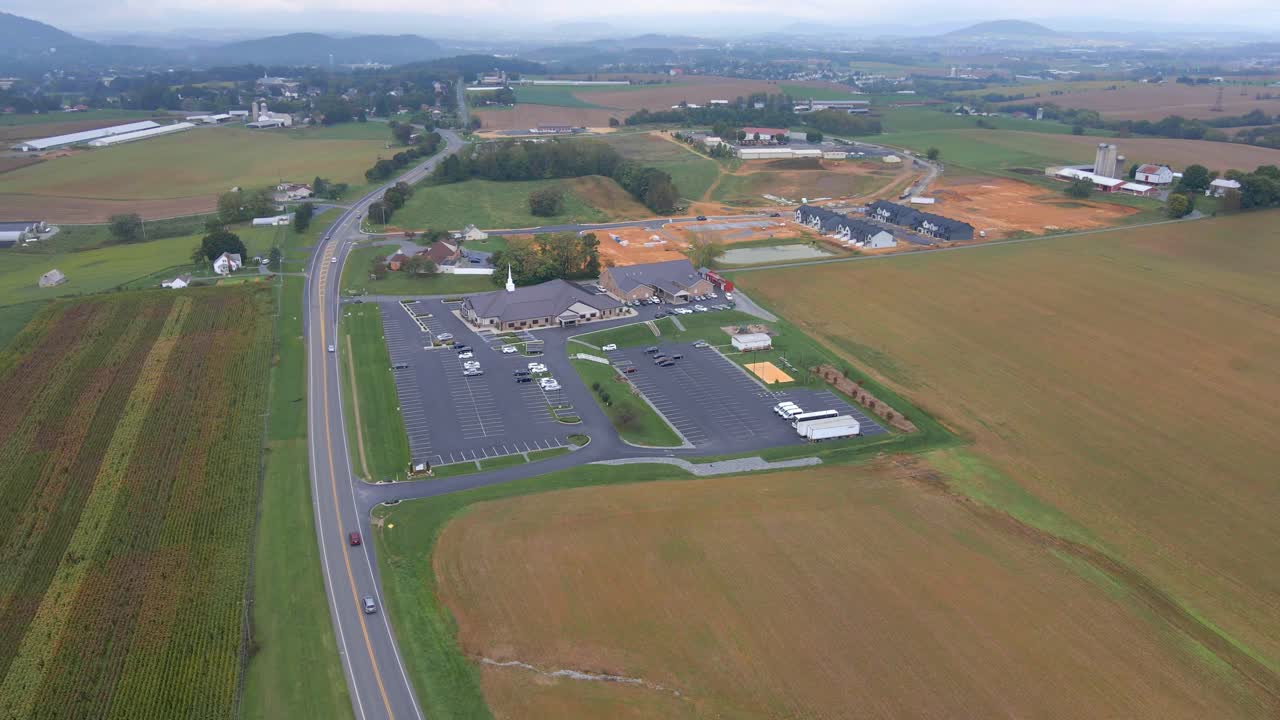 Aerial shot of a church in Virginia with a new subdivision being built in the background