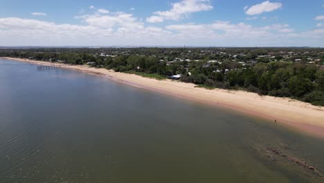 stunning aerial shot of torquay beach jetty and sandy shores - hervey bay