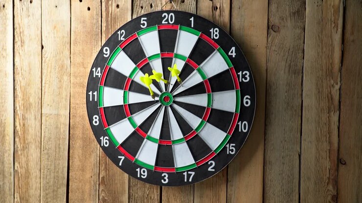 Darts game. Throwing darts at the target