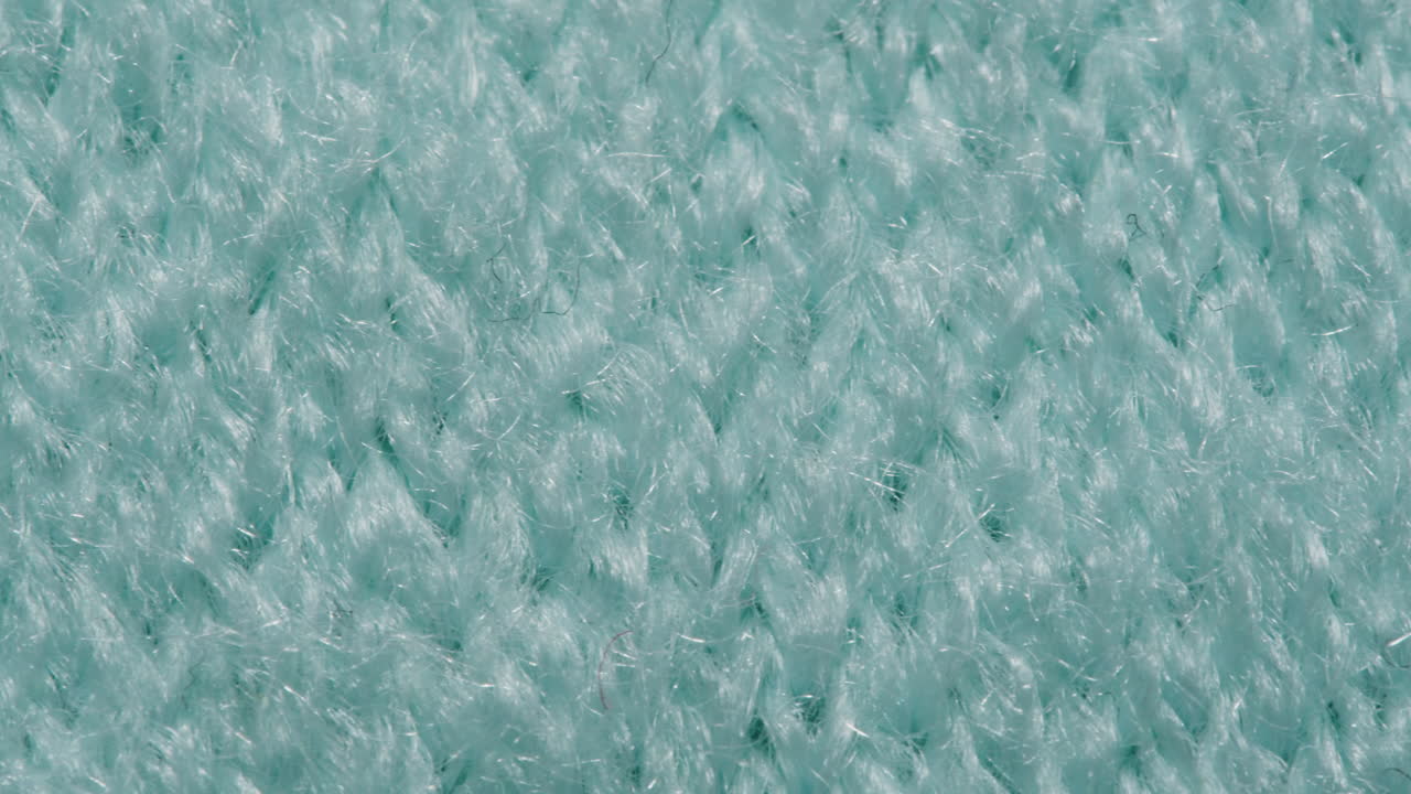 Close-up of Teal Knitted Fabric Texture