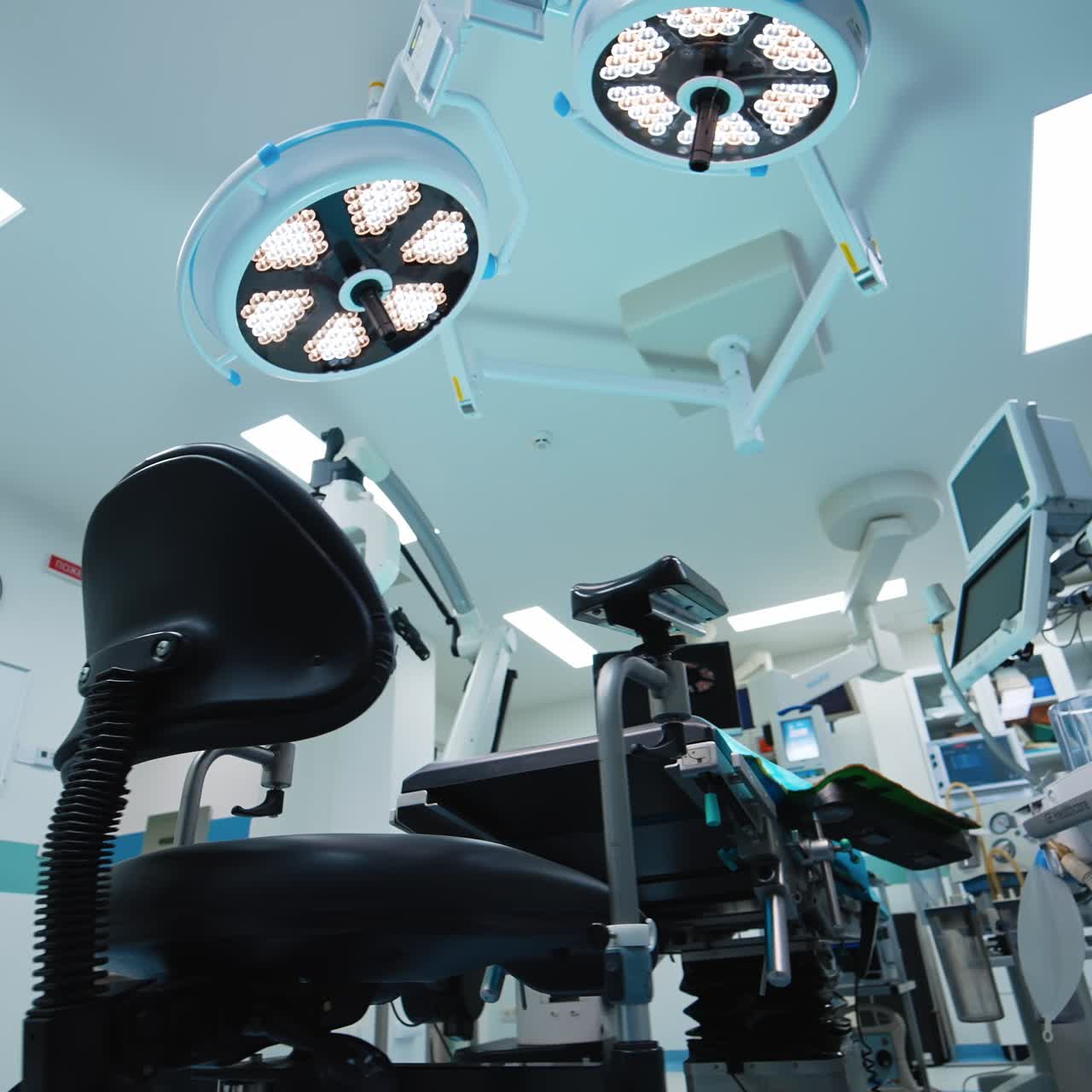 Circle movement around the advanced equipment in the empty surgical room. Low angle footage of the neurosurgical theatre