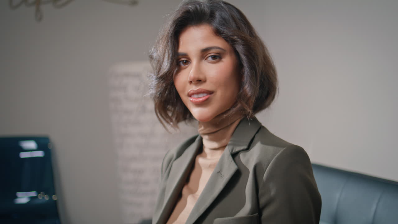 Portrait lady adjusting hairstyle in modern interior. businesswoman