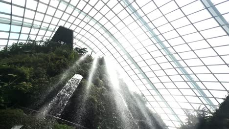 scenic waterfall in cloud forest, gardens by the bay in singapore - low angle shot