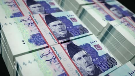 billetes de dinero de rupias pakistaníes envueltos en un bucle sin costuras