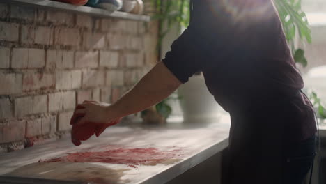 Person working with clay in a kitchen