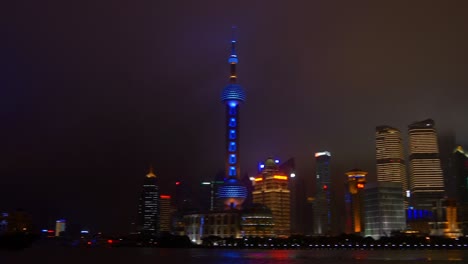 hora nocturna iluminada ciudad de shanghai bahía de pudong panorama 4k china