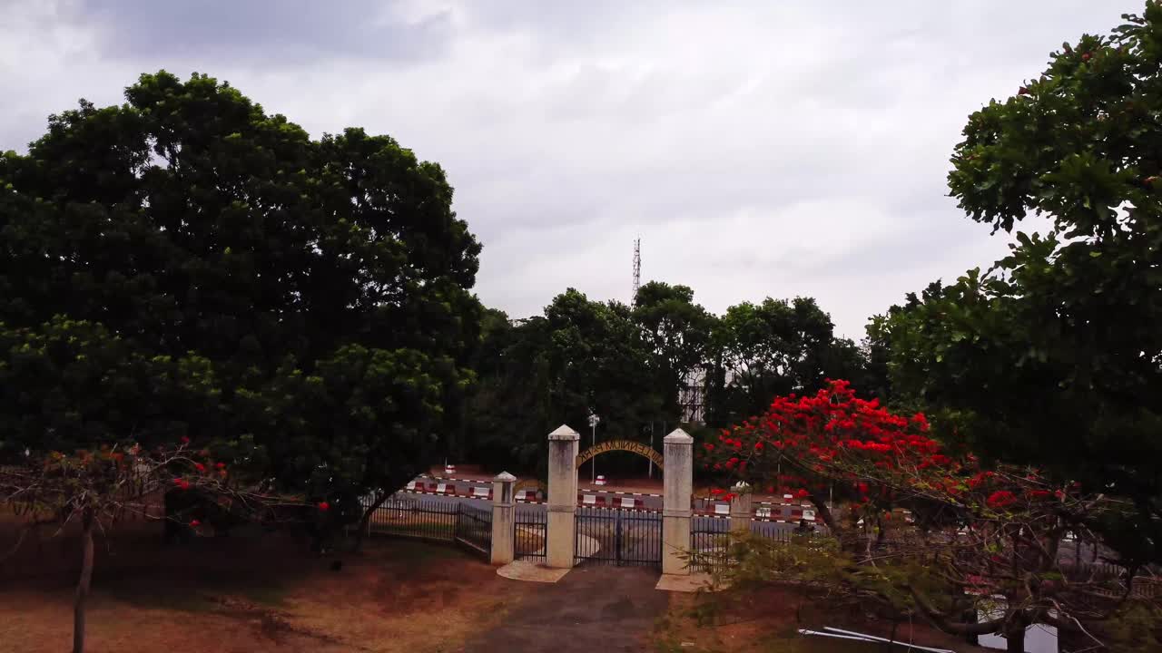 Beautiful aerial of the exit of the millennium Park in Abuja, Nigeria. The drone slow ascends in the sky