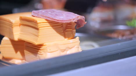 stacked sliced cheese and ham