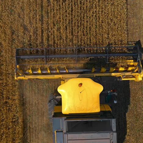 agricultural machinery theme. great modern yellow combine from above. selective focus from dron