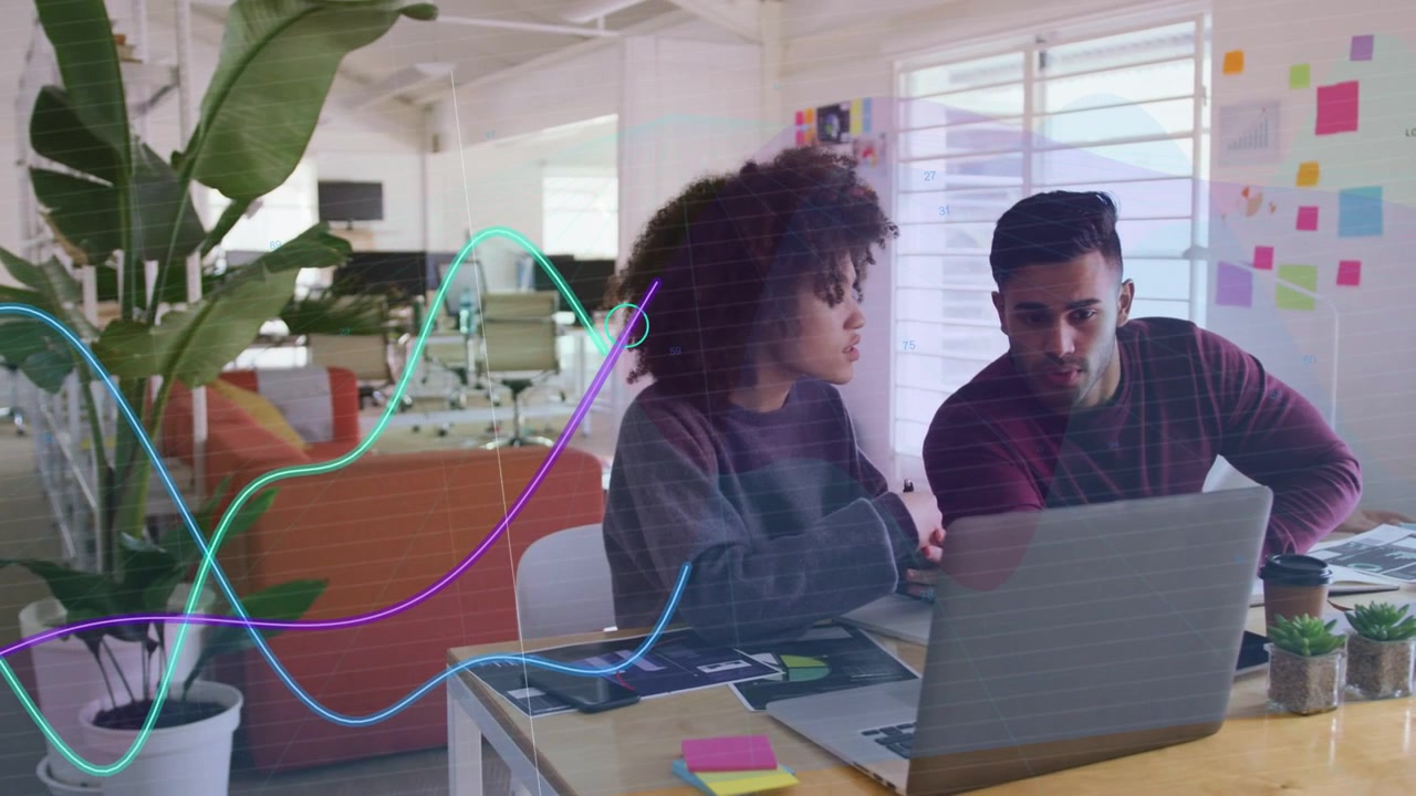 Woman holding pen pointing laptop, man leaning animated waveforms overlaying scene reviewing design