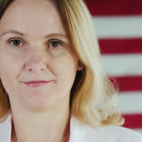 Woman's-Face-Of-Doctor-Wearing-Medical-Mask-Amid-American-Flag