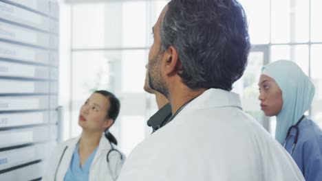 doctors meeting around a whiteboard 4k