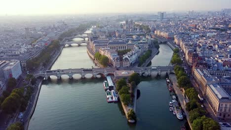 Morning-aerial-panoramic-view-on-western-tip-of-Ile-de-la-Cite-island-with-traffic-on-Pont-Neuf,-Paris,-France