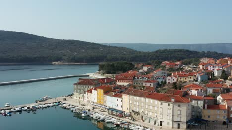 panoramic view of town of cres on the island of cres in croatia - aerial orbit