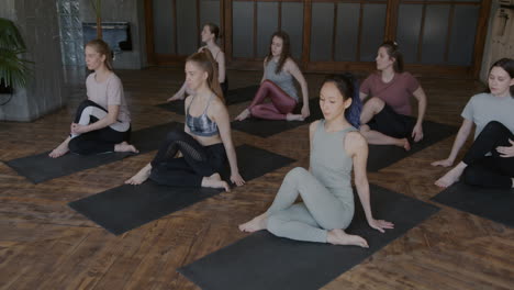 group of women practicing yoga