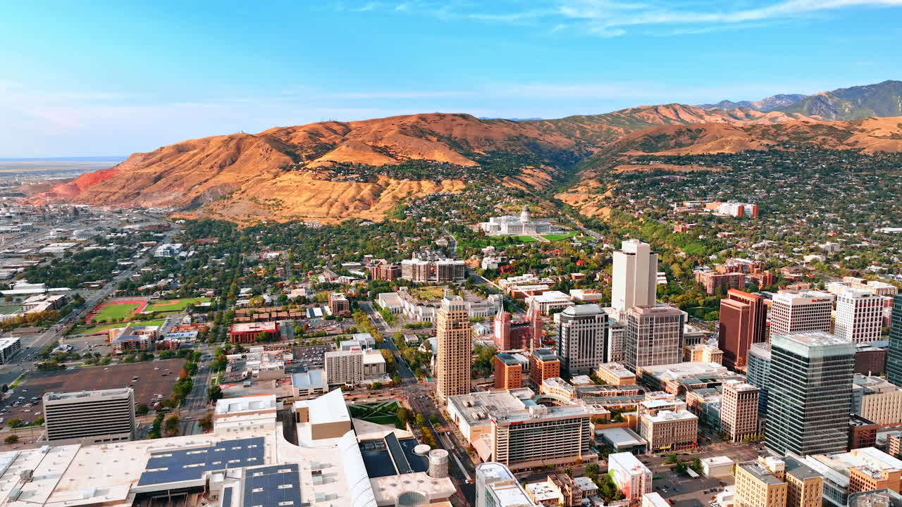 Salt Lake City USA, 1 August 2025: Aerial view of Salt Lake City skyline with Utah mountains. Downtown Salt Lake City skyline with mountains in the background viewed from above