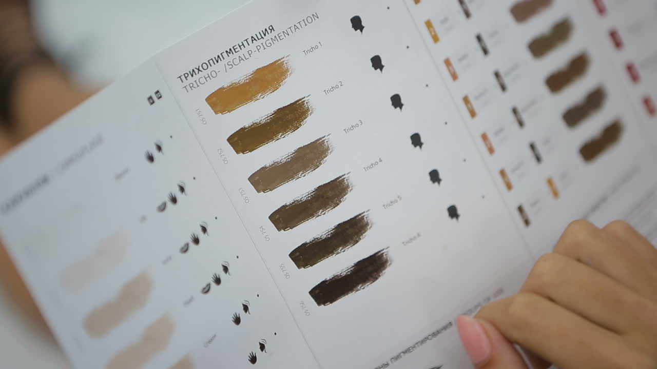 Choosing Paints For Makeup. Woman choosing paints for permanent makeup