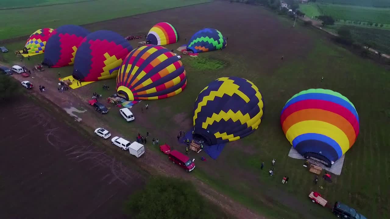 Hot air balloons being inflated for a flight.