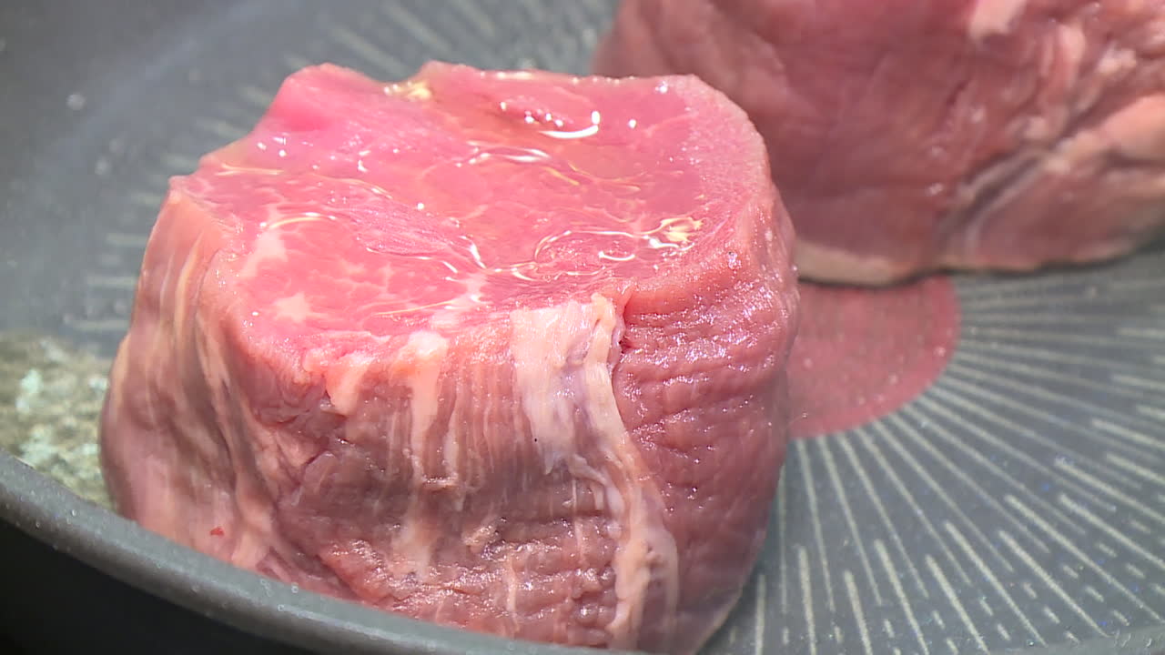 Raw Steak Cooking in a Pan