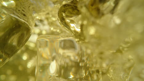 close-up of ice cubes and liquid