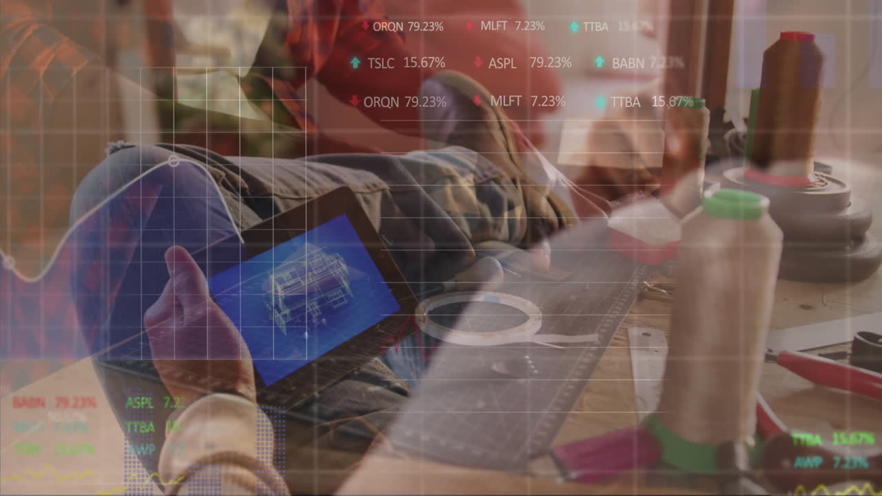 design collaborators holding tablet and crafting prototype in tech studio, with floating data grids