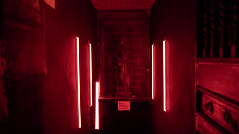 room with red lights in the hallway