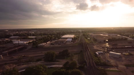 Aerial-of-railroad-yard-at-sunset