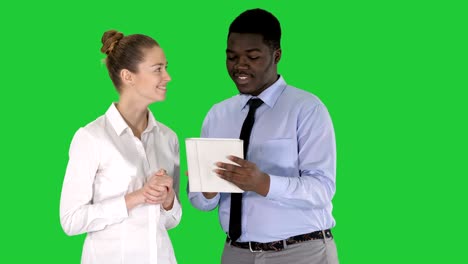 modern business people working on a tablet on a green screen, chroma key