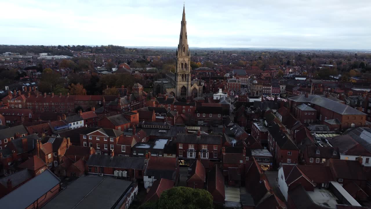 Aerial View of a Historic Town with a Prominent Church Spire