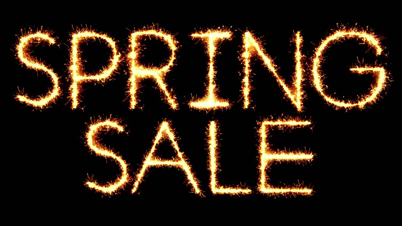 Spring sale text sparkler writing with glitter sparks particles firework on black 4k loop background