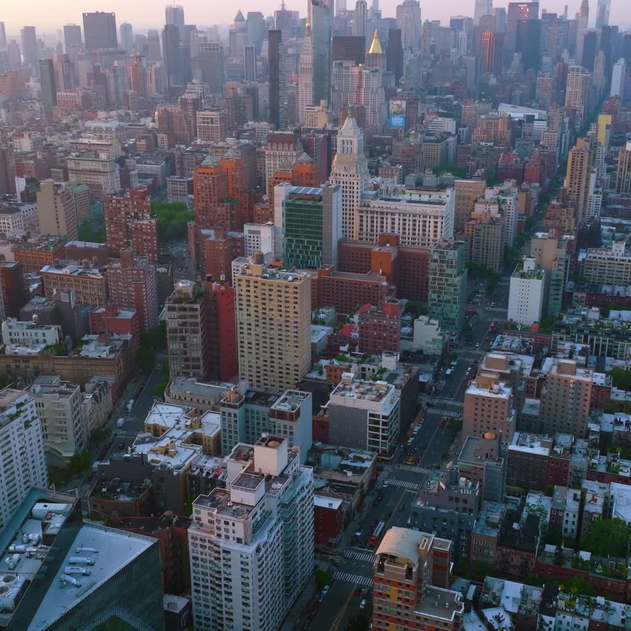City scenery with diversity of modern architecture. Amazing New York panorama hazy at backdrop. Top view