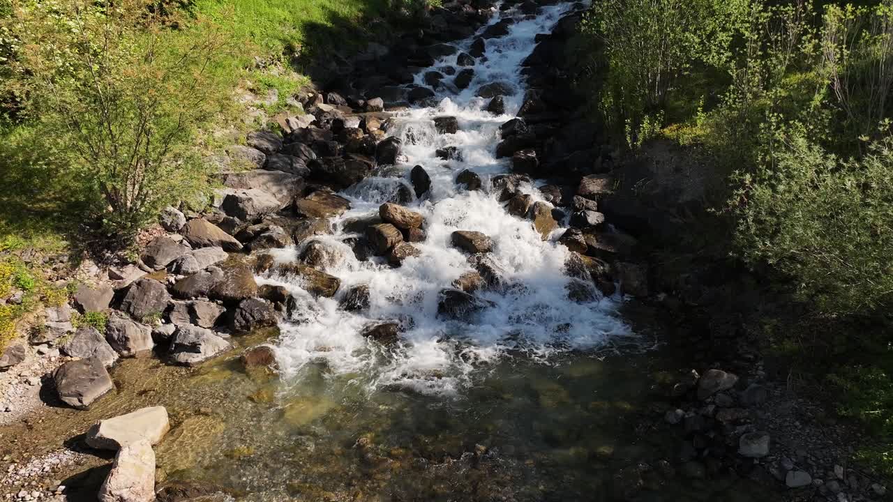 Water running over pebbles rocks at Walensee, Switzerland