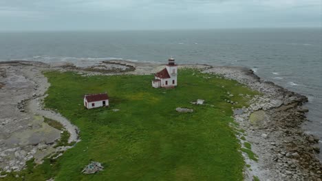 abandoned lighthouse on creepy island, newfoundland, canada, drone clip 4k