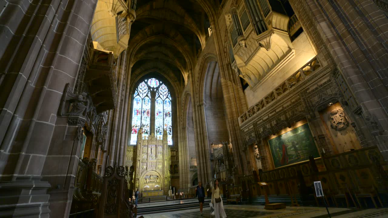 Majestic organ pipes reach towards the vaulted ceiling of Liverpool Anglican Cathedral, creating a sense of awe and reverence