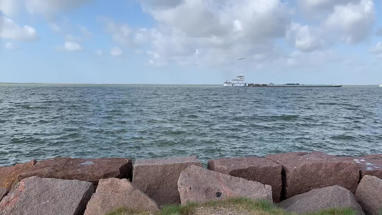this is a time lapse of ships sailing around the Texas City Dike