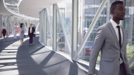 businessman walking with luggage in the corridor at office 4k