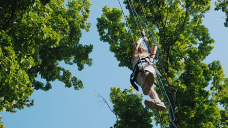 a brave child takes steps on a staggered cable at a height overcome fear concept