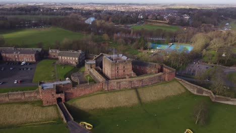 drone revealing carlisle castle with bitts park and river eden in background - cumbria, england