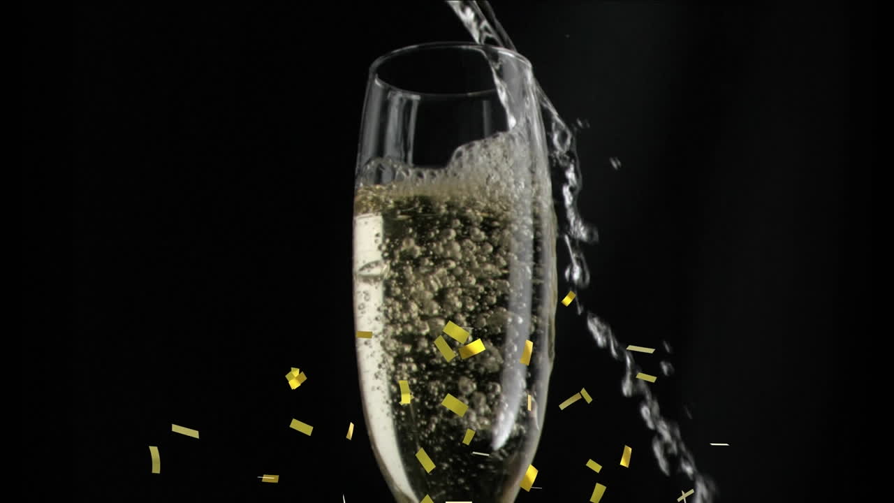 검은색 배경에서 폭발하는 페인과 노란색 콘페티의 애니메이션