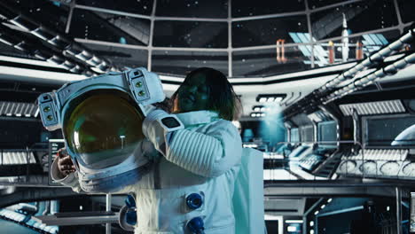 portrait of happy astronaut holding helmet in orbital station