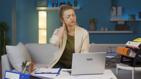 home office worker woman has neck pain.