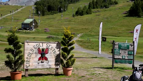 golf course entrance with scenic mountain backdrop