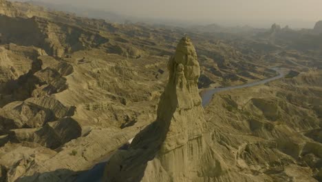 aerial view of the makran coastal highway in balochistan, pakistan, featuring winding roads through dramatic rocky landscapes under a clear sky