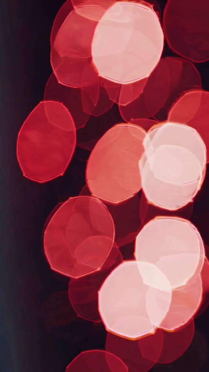 Abstract Red Bokeh Lights Shimmering on Dark Background