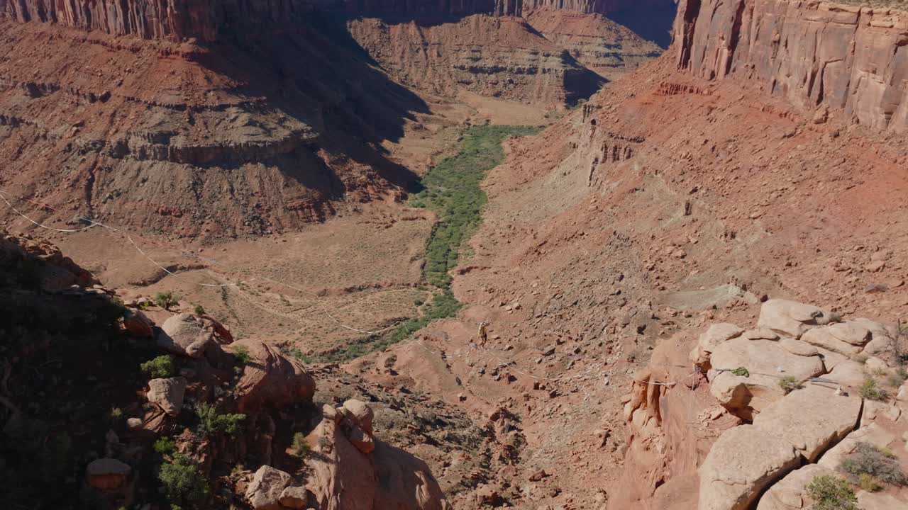 Daring highliner walks on tightrope over Moab's red rock canyon landscape
