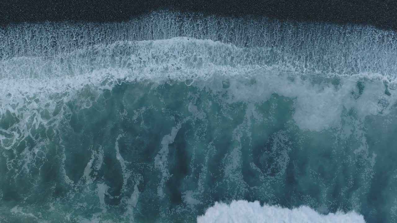 Aerial Top Down Drone Abstract of Shorebreak on Black Rocks El Tunco El Salvador