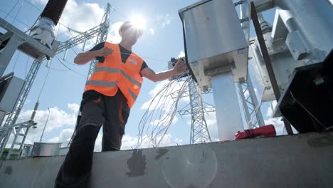 electrical engineers inspect the electrical systems at the equipment control cabinet