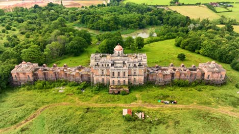 highcross manor aka hamilton palace. uckfield, sussex. 4k drone footage approaching front of palace from northerly position. lake, boat house and palace seen in video. includes brass dome flyover.