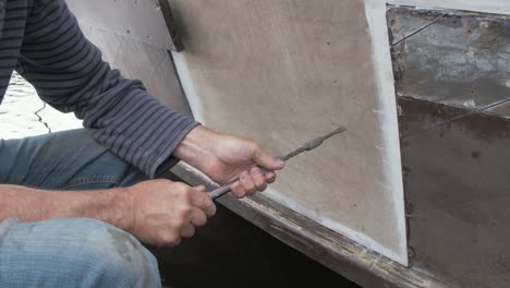 Using-a-Yankee-screwdriver-to-secure-plywood-boat-repair