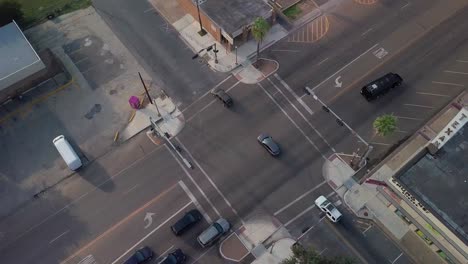 AERIAL---Intersection-with-light-traffic-in-McAllen,-Texas,-top-down-circle-pan